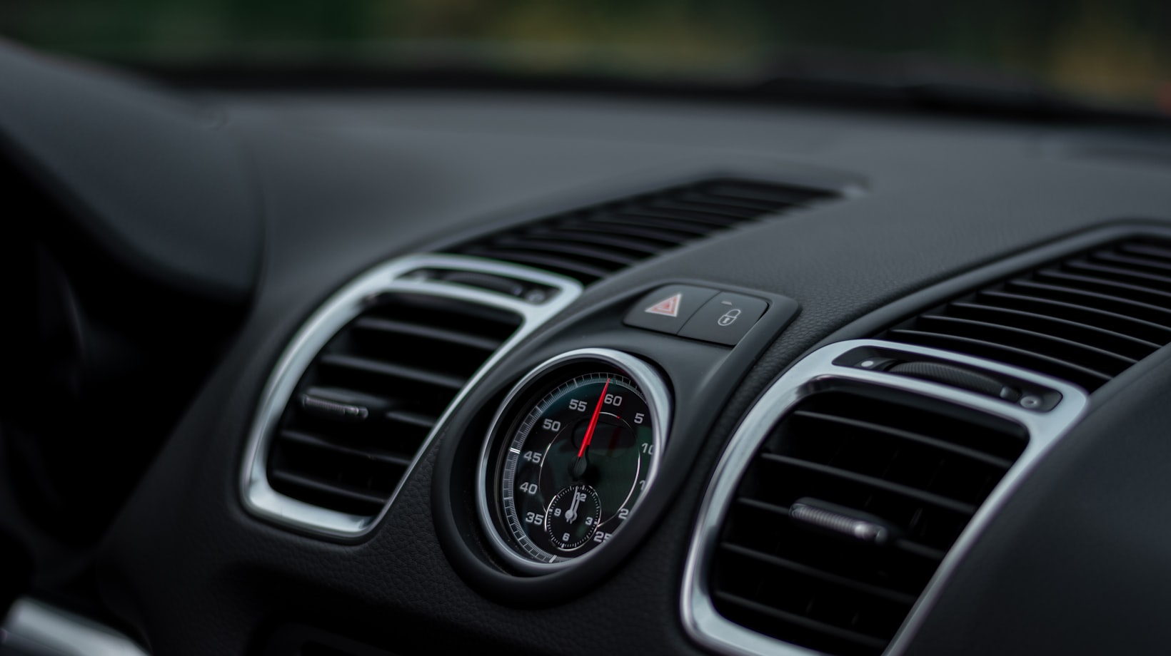 Dashboard air vents and climate controls in a German sports car