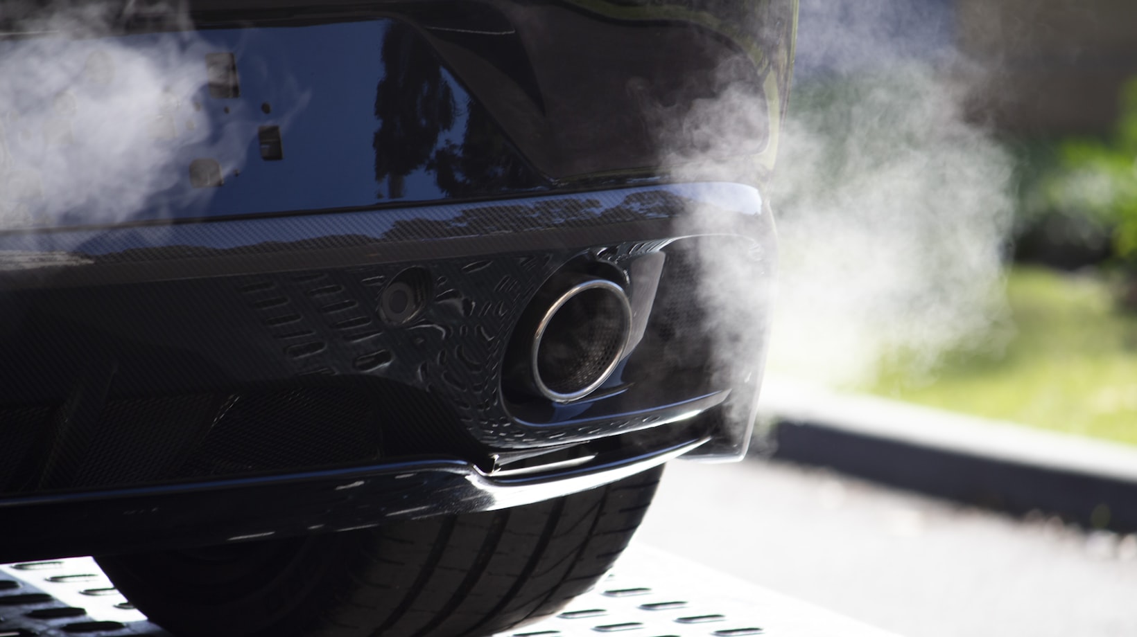 Exhaust coming from the tailpipe of a German car during an emissions test