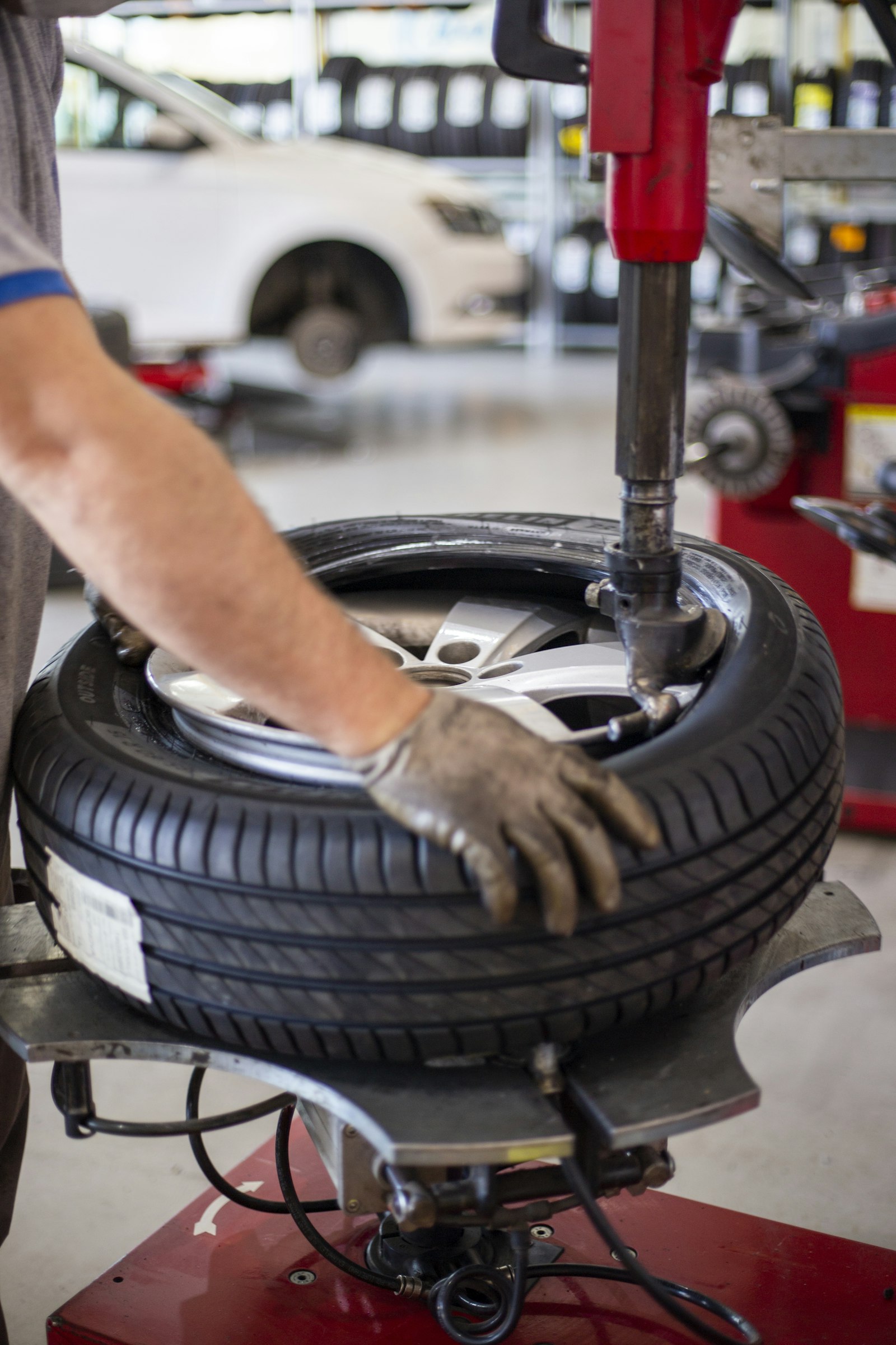 Tire being mounted onto an alloy wheel on a workshop tire machine